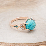Shown here is "Lucy in the Sky", a halo-style hexagon turquoise women's engagement ring with diamond accents and turquoise inlays, facing right. Many other center stone options are available upon request.