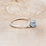 "BLOSSOM" - ROUND CUT AQUAMARINE ENGAGEMENT RING WITH LEAF-SHAPED DIAMOND ACCENTS