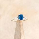"BLOSSOM" - EMERALD CUT BLUE TOPAZ ENGAGEMENT RING WITH DIAMOND ACCENTS