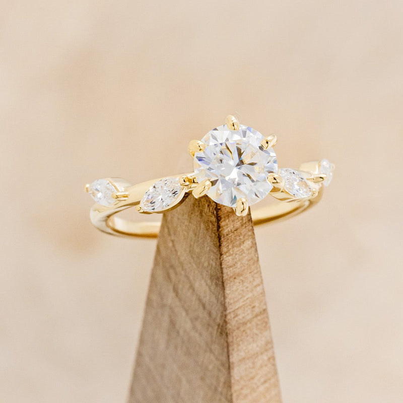 "FLORA" - ROUND CUT MOISSANITE ENGAGEMENT RING WITH LEAF-SHAPED DIAMOND ACCENTS - 14K YELLOW GOLD - SIZE 4 1/2-1