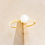 "HOPE" - ROUND CUT OPAL SOLITAIRE ENGAGEMENT RING WITH FEATHER ACCENTS