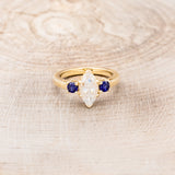 MARQUISE CUT MOISSANITE ENGAGEMENT RING WITH LAB-GROWN DARK BLUE SAPPHIRE ACCENTS