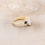 MARQUISE CUT MOISSANITE ENGAGEMENT RING WITH LAB-GROWN DARK BLUE SAPPHIRE ACCENTS