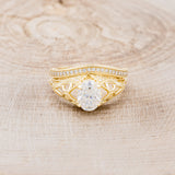 "RELICA" - OVAL MOISSANITE ENGAGEMENT RING WITH DIAMOND ACCENTS & DIAMOND TRACER