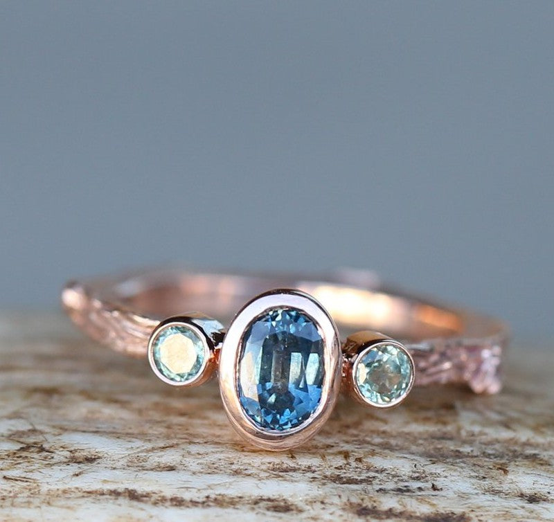 Shown here is A twig-style London blue topaz women's engagement ring with delicate and ornate details and is available with many center stone options-TWIG STYLE ENGAGEMENT RING WITH SAPPHIRE STONES (available in 14K yellow, rose, and white gold) - Staghead Designs - Antler Rings By Staghead Designs